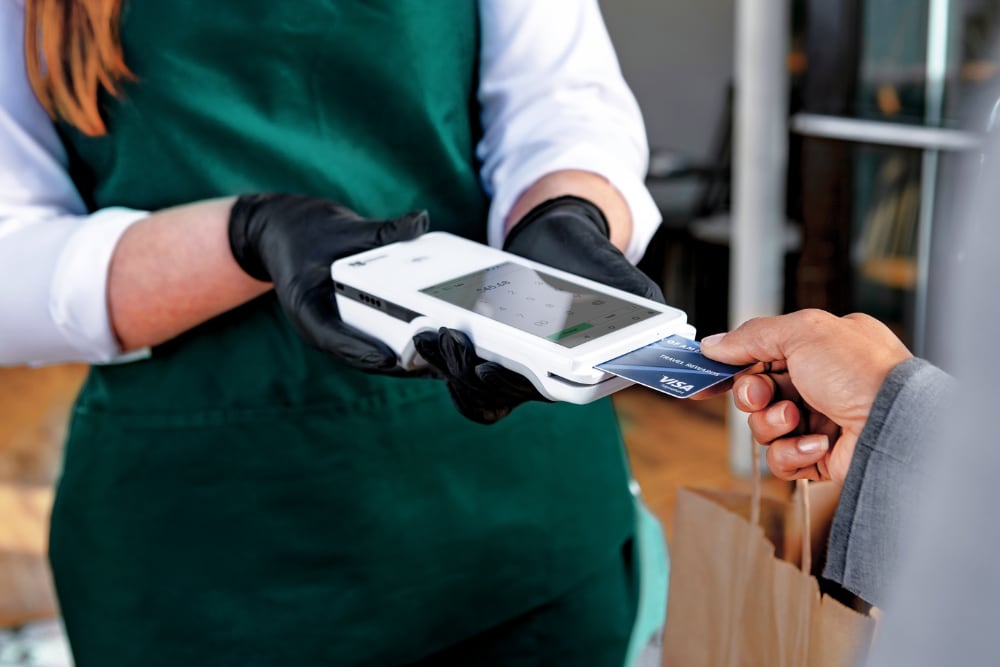 Merchant collecting mobile payment on Clover Flex